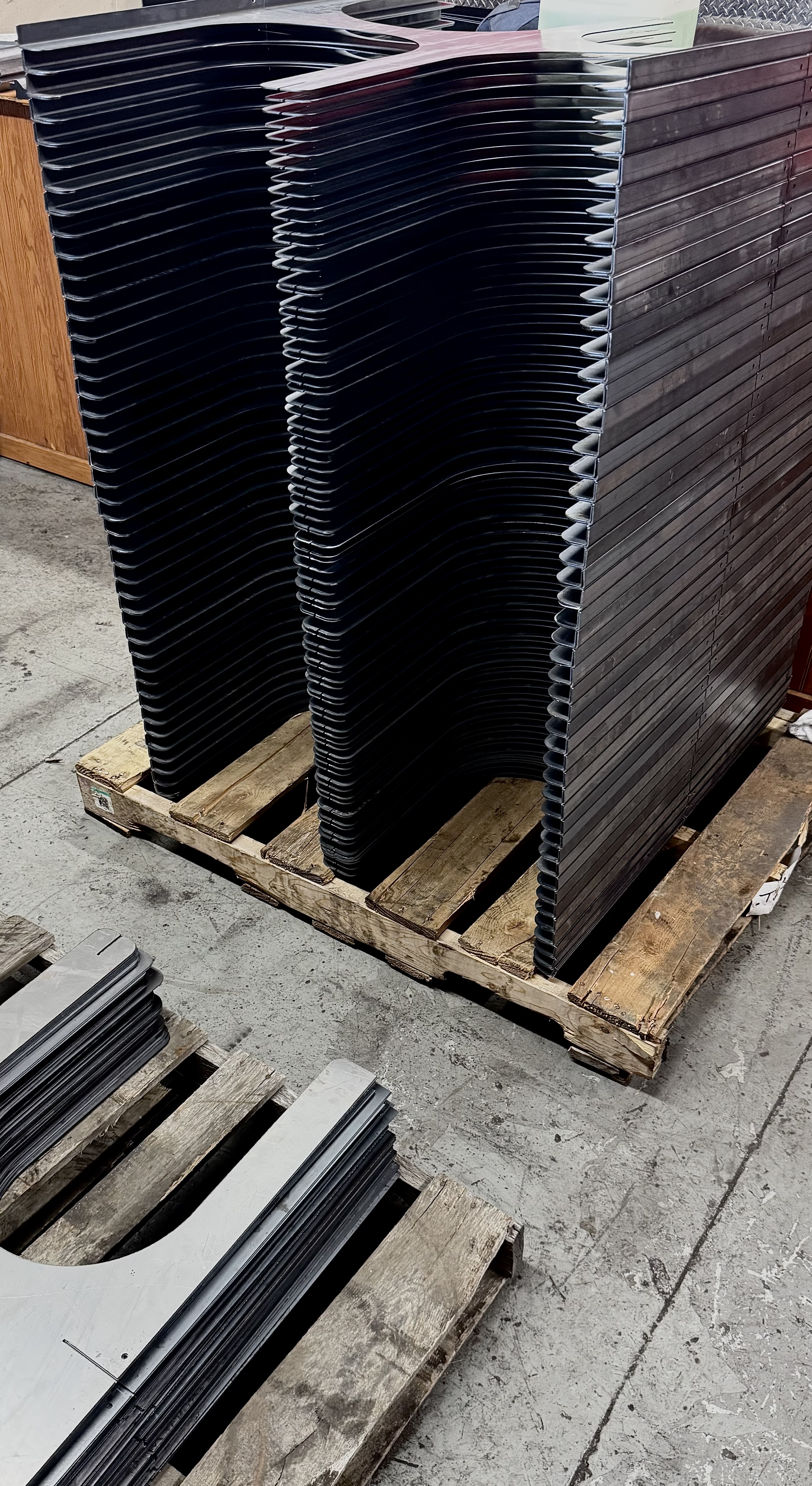 Finished custom metal components prepared for a North Texas fabrication project